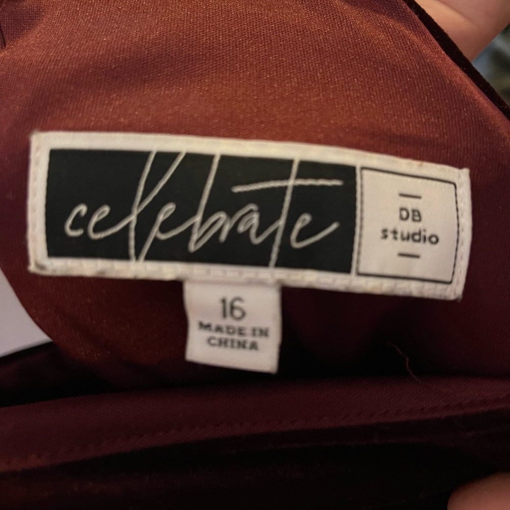 cute maroon dress is a velvet material, only worn once!